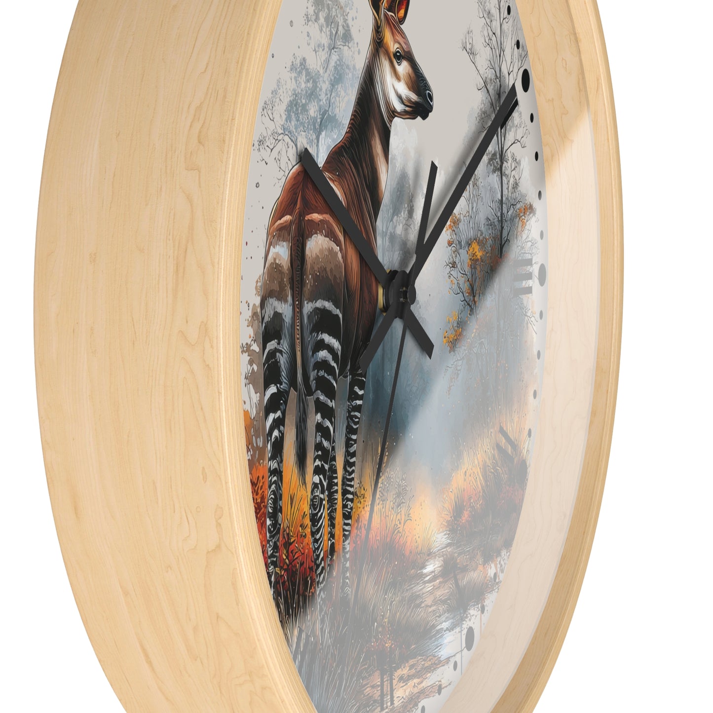 Round wall clock with a light natural wood frame and a printed center featuring a large antelope standing in a misty forest scene with black clock hands.