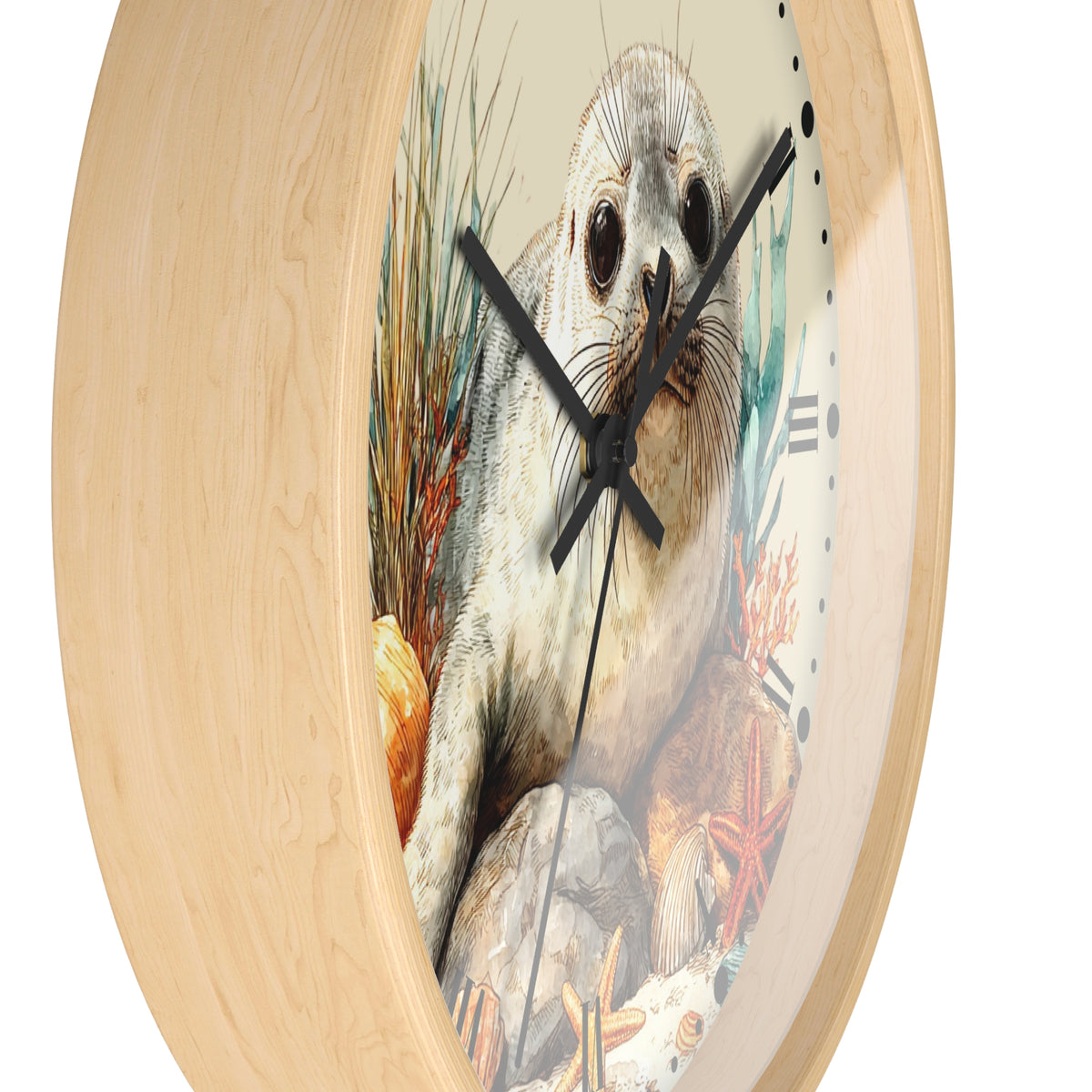 A round wall clock with a light natural wood frame and a printed center illustration of a seal on an ocean reef, shown against a plain white background.