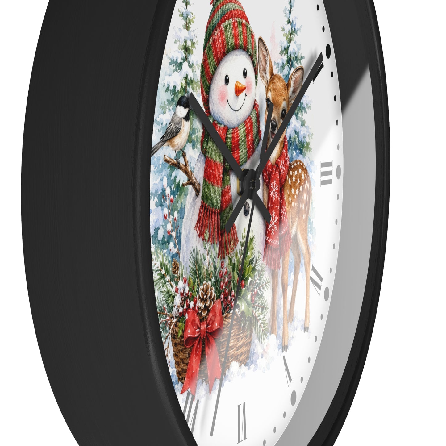 A round wall clock with a black frame and a festive winter illustration on the face, featuring a snowman in a red striped hat and scarf, a deer, a bird, and evergreen branches on a white background.