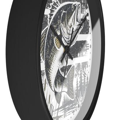 A close-up of a wall clock with a black frame and a white dial featuring a detailed black-and-gray wide mouth bass fish illustration with small gold accents.