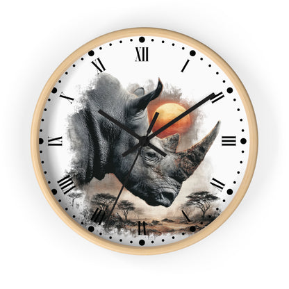 A round wall clock with a light wood frame and a white face featuring a detailed rhinoceros illustration, Roman numerals, black hour markers, and a small scenic landscape near the bottom.