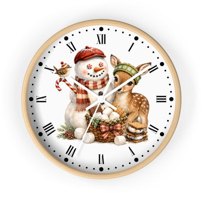 A round wall clock with a light wood frame and a white face featuring a winter holiday illustration of a snowman, a deer, a bird, and a basket of eggs.