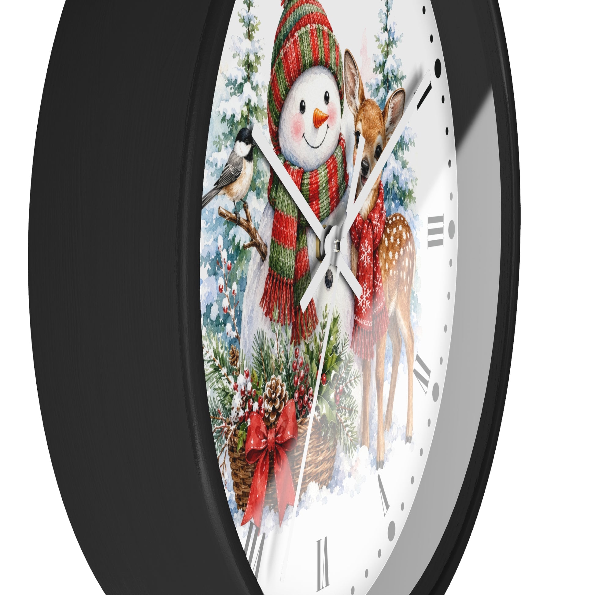 A round wall clock with a black frame and a festive winter illustration on the face, featuring a snowman in a red and green scarf, a deer in a red dress, a bird, and holiday greenery on a white background.