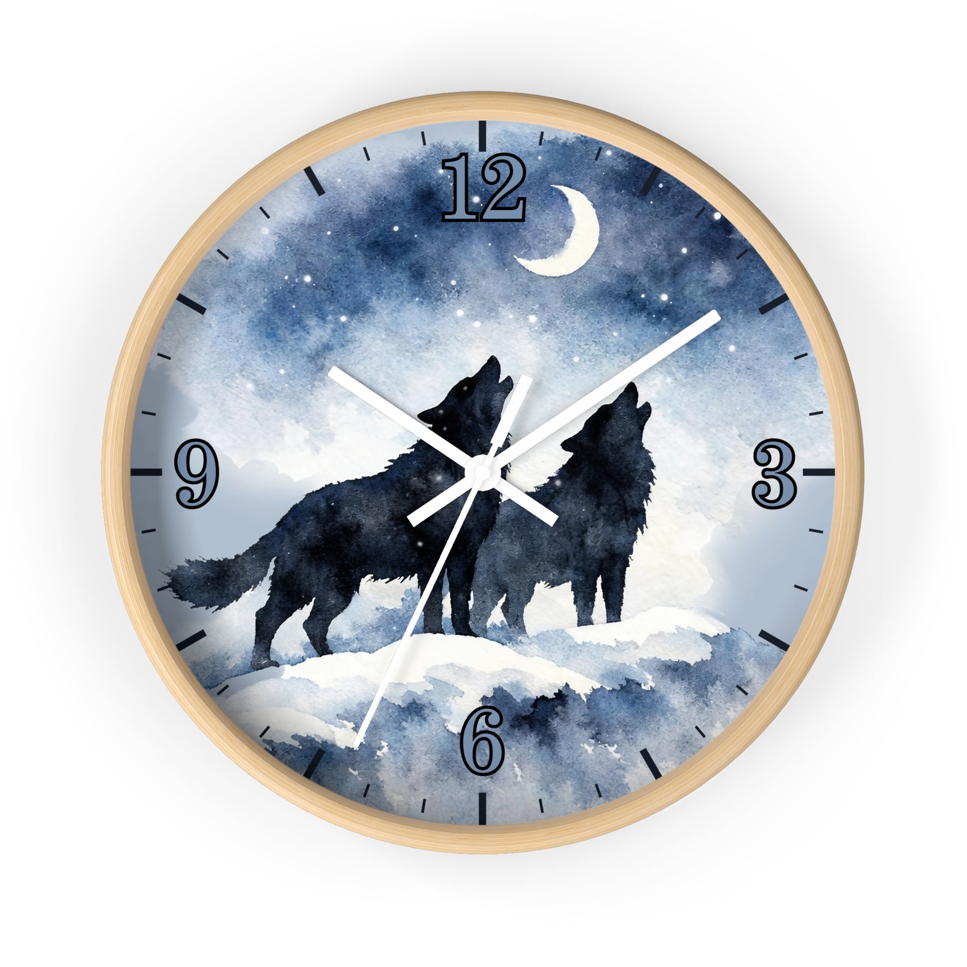 Round wall clock with a light wood frame and a watercolor-style night sky face showing two black howling wolves under a crescent moon and stars. The clock has blue-toned numerals and white hands on a white background.