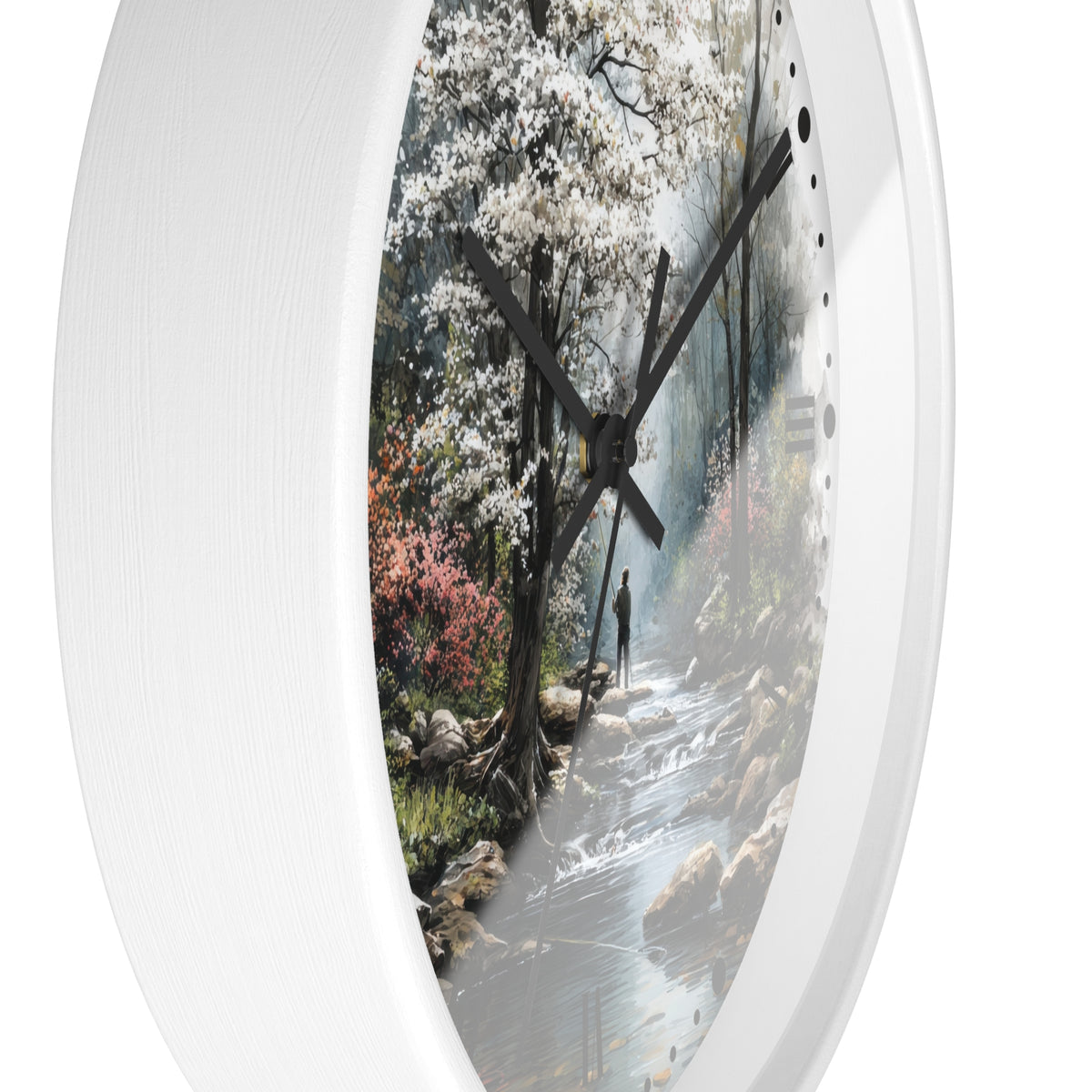 Round wall clock with a white frame and a printed scenic landscape face showing a forest stream, white blossoms, rocks, and dark clock hands.