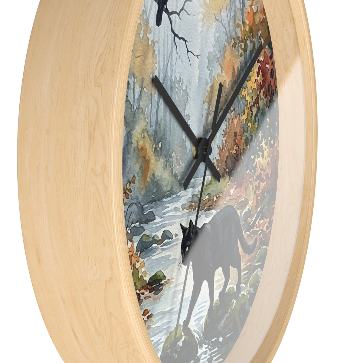 Round wall clock with a light natural wood frame and a printed scenic dial showing a forest stream, autumn foliage, and a black cat silhouette.