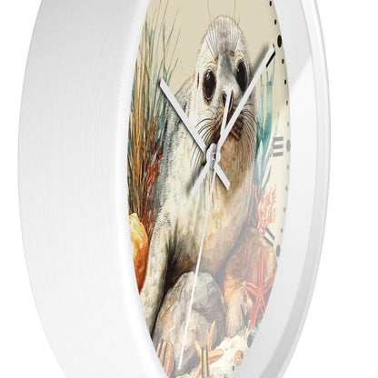 A round white wall clock with a detailed illustration of a seal on the face, featuring black Roman numerals and silver hands, shown against a plain white background.