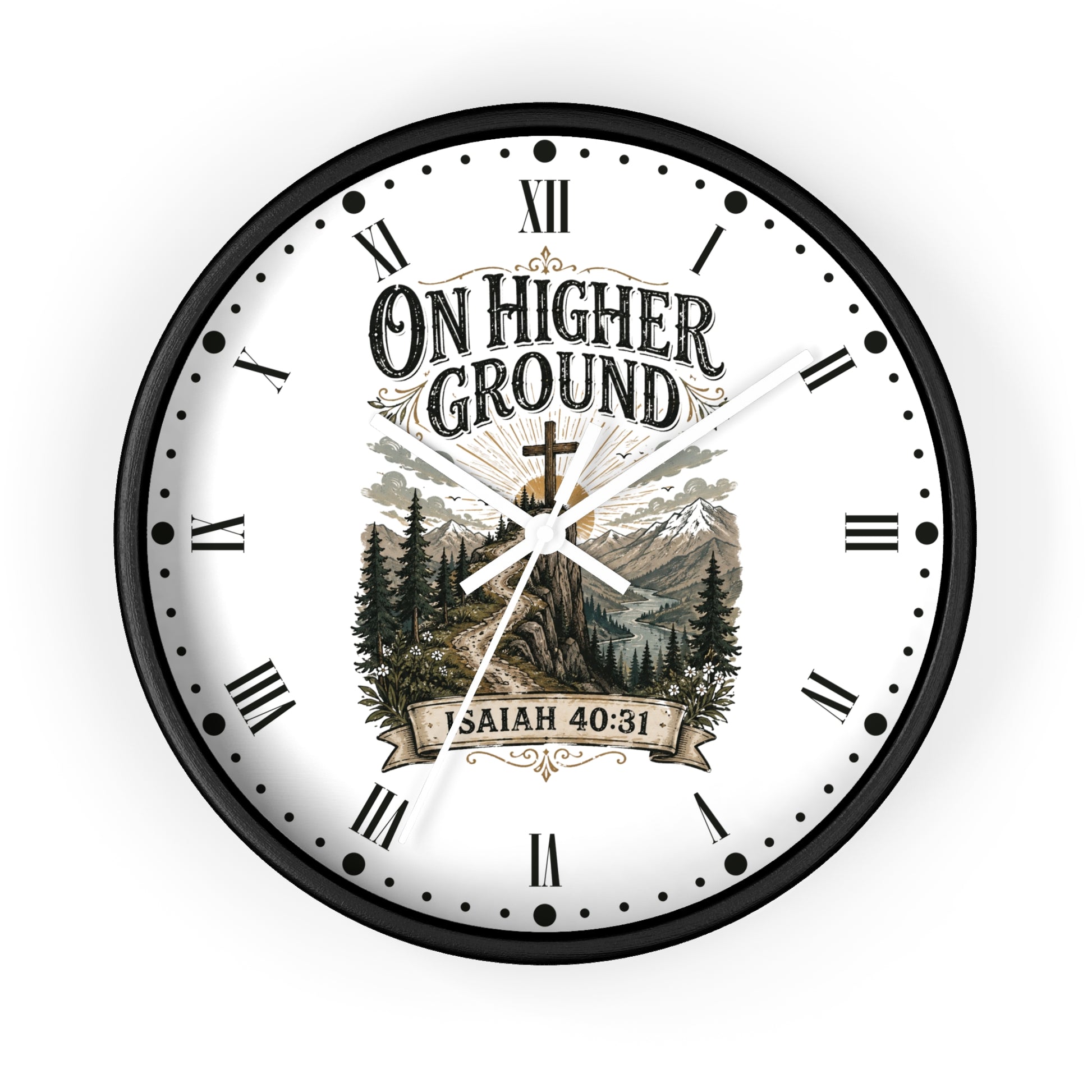 A round wall clock with a black frame and a white face featuring the text 'ON HIGHER GROUND' and 'ISAIAH 40:31' over a scenic mountain and forest illustration. Roman numerals and black hour markers surround the dial.