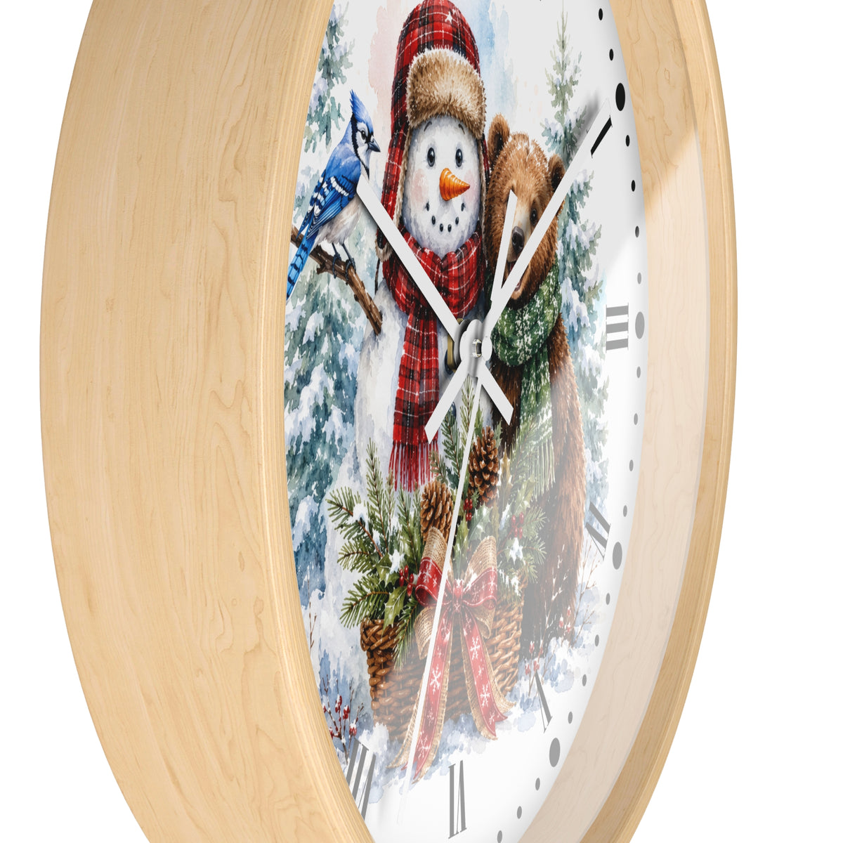 A round wall clock with a light natural wood frame and a white face featuring a winter scene of a snowman in a red scarf, evergreen trees, pinecones, and a blue bird, shown against a plain white background.