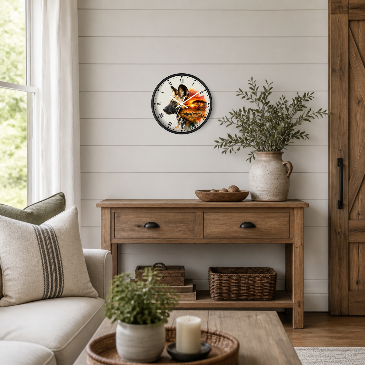 A round wall clock with a rustic wood-grain face and black Roman numerals hangs on a white shiplap wall above a wooden console table in a styled living room.