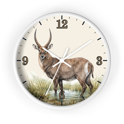 Round wall clock with a white frame and a printed animal illustration of a brown antelope standing in water, with black numerals and hands on a light cream face.