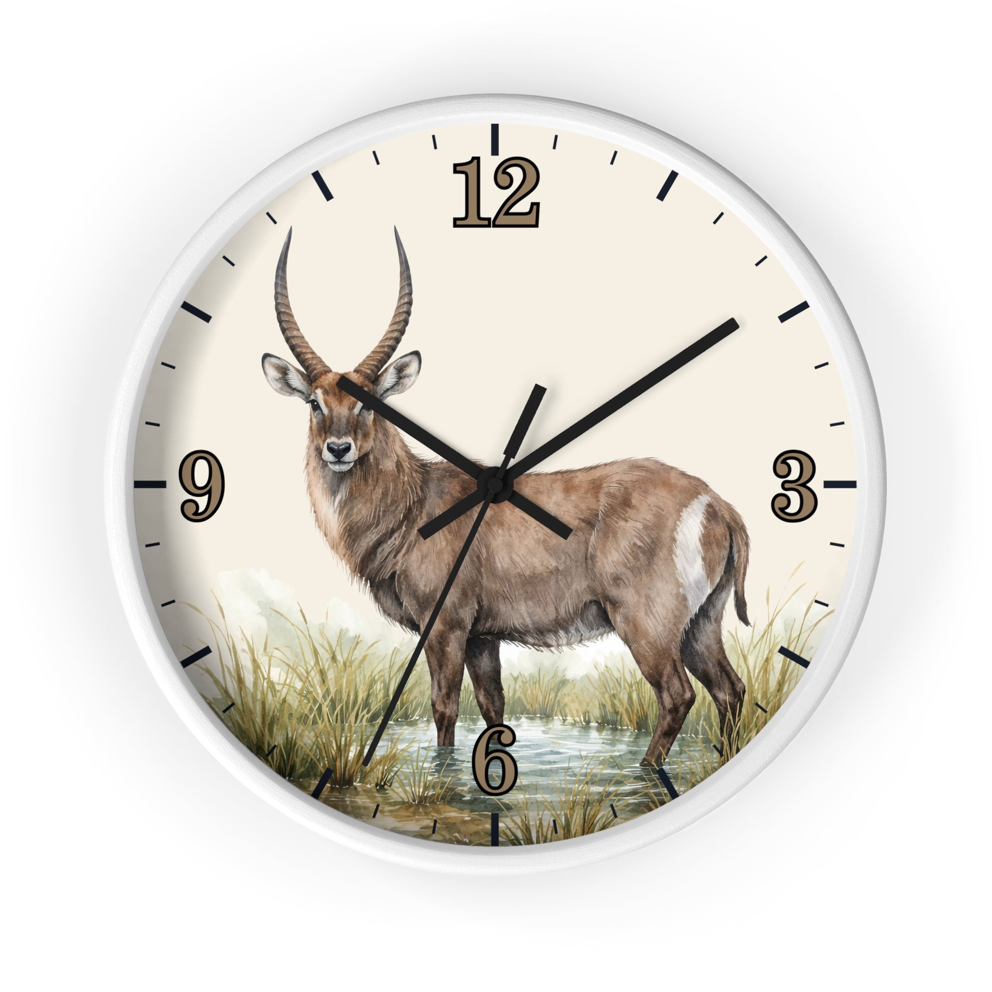 A round wall clock with a white frame and a cream-colored face featuring a detailed illustration of a waterbuck standing in grassy terrain. The clock has black hour and minute markers and black hands.