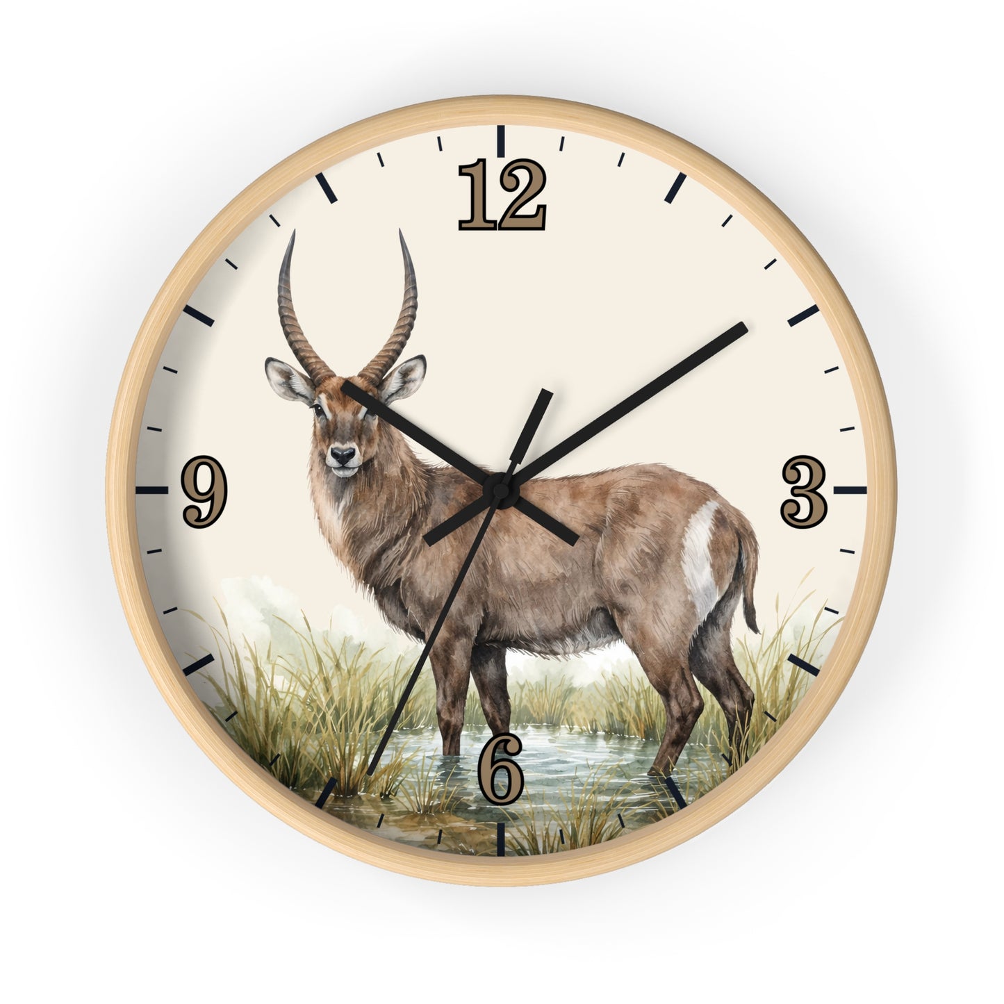 Round wall clock with a light wood frame and a cream-colored face featuring a detailed illustration of a waterbuck standing in grassy terrain. The clock has black hands, black hour markers, and a black outer rim, shown against a plain white background.
