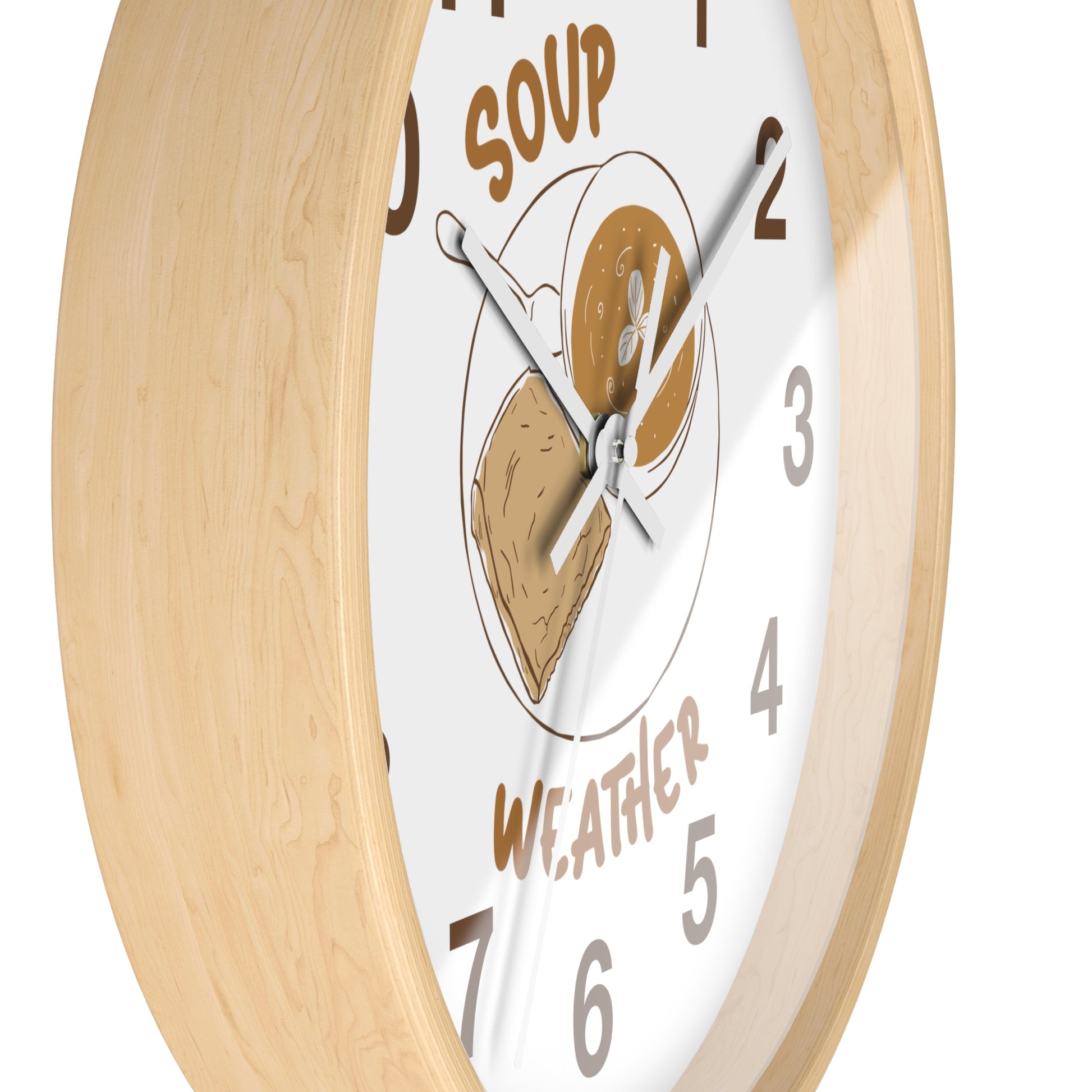 A round wall clock with a light natural wood frame and a white face featuring a peanut butter and jelly sandwich illustration and the words 'SOUP WEATHER'.