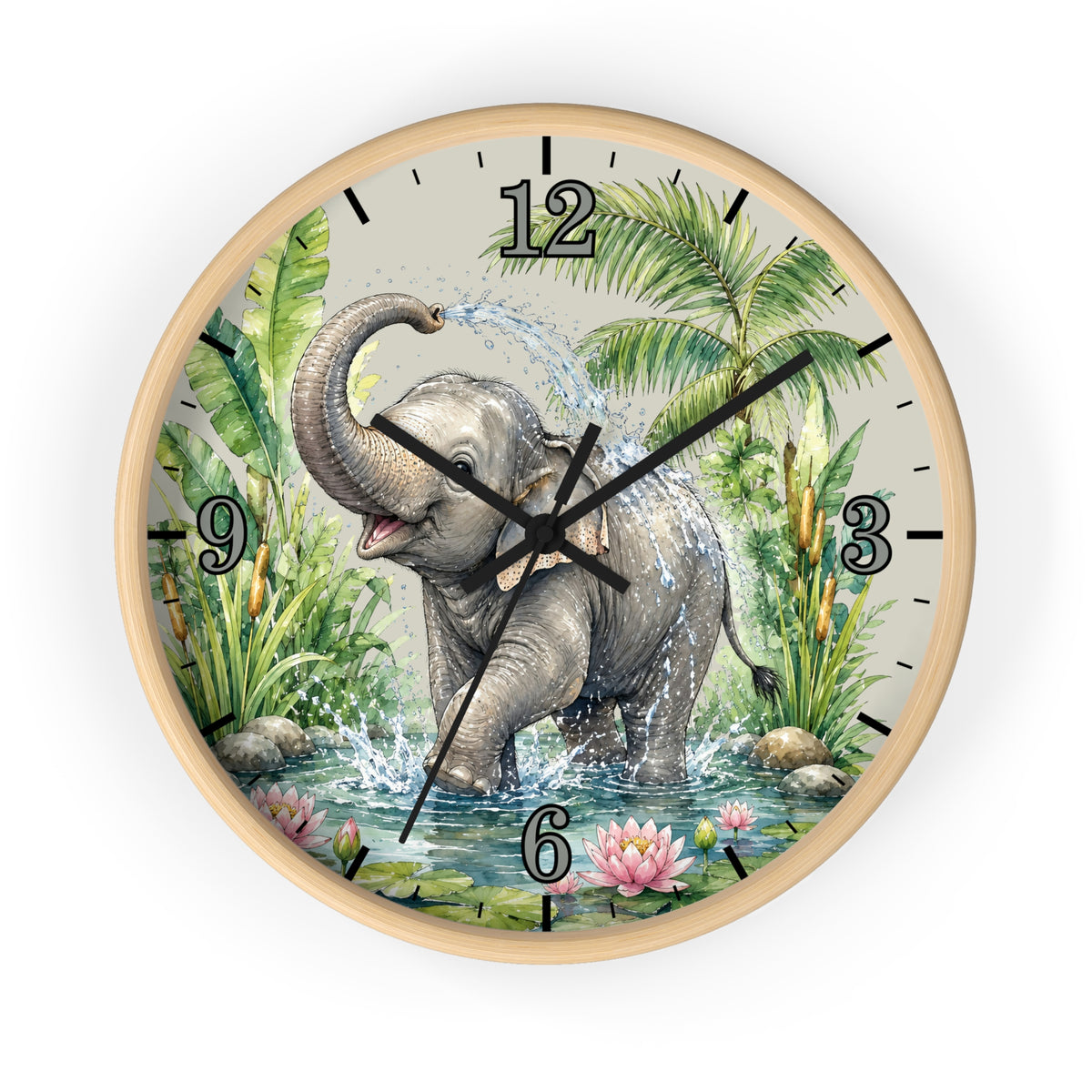 Round wall clock with a light wood frame and a printed illustration of a gray elephant standing in shallow water, surrounded by green tropical plants and pink flowers. The clock face has black Arabic numerals and black hands on a white background.