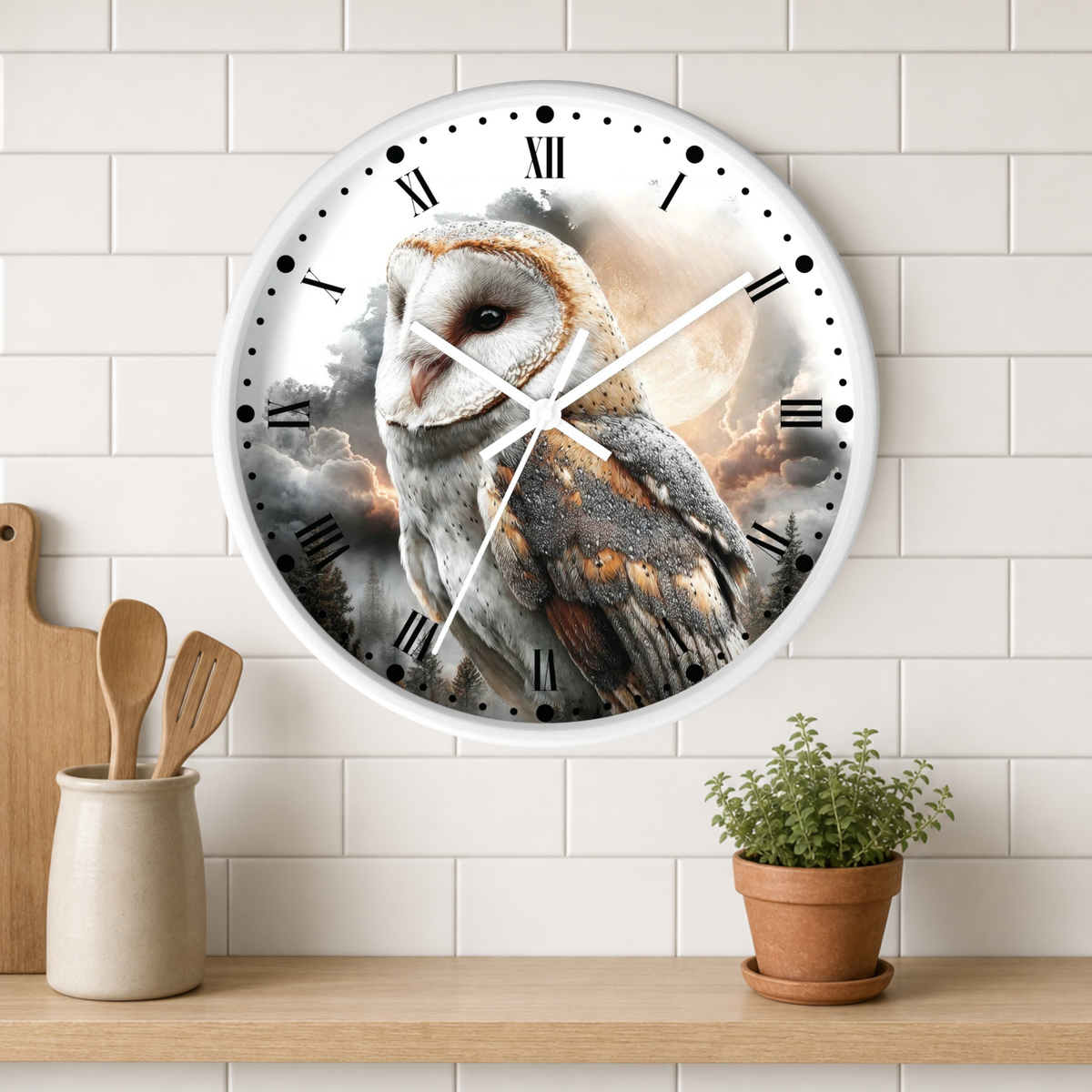 A round wall clock with a barn owl illustration and Roman numerals, mounted on a white subway tile wall above a wooden shelf with kitchen utensils and a potted plant.