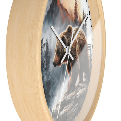 Round wall clock with a light natural wood frame and a printed scenic face showing a brown bear walking through a misty forest at sunset, photographed on a white background.
