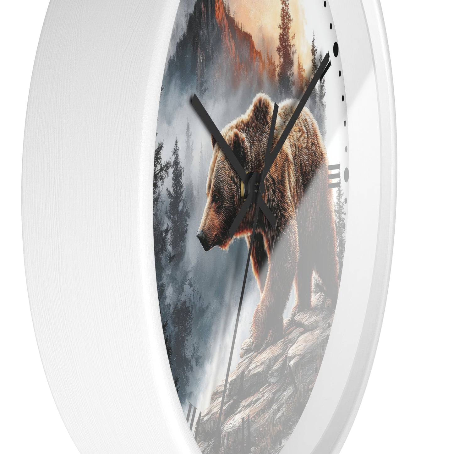 Round white wall clock with a printed nature scene on the face showing a brown bear walking among trees and mountains, photographed against a plain white background.