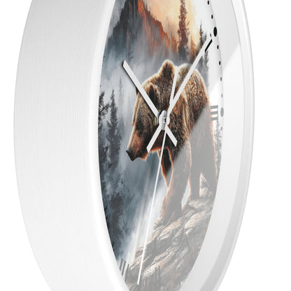 Round wall clock with a white frame and a printed scenic face showing a brown bear standing on rocky ground in a misty forest landscape. The clock has white hands and black hour markers.