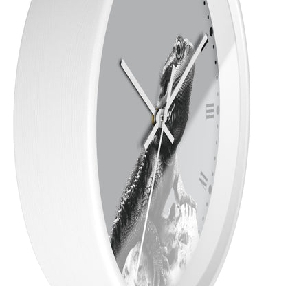 A white round wall clock with a grayscale bearded dragon lizard graphic printed on the face, featuring white hands and minimalist Roman numerals.