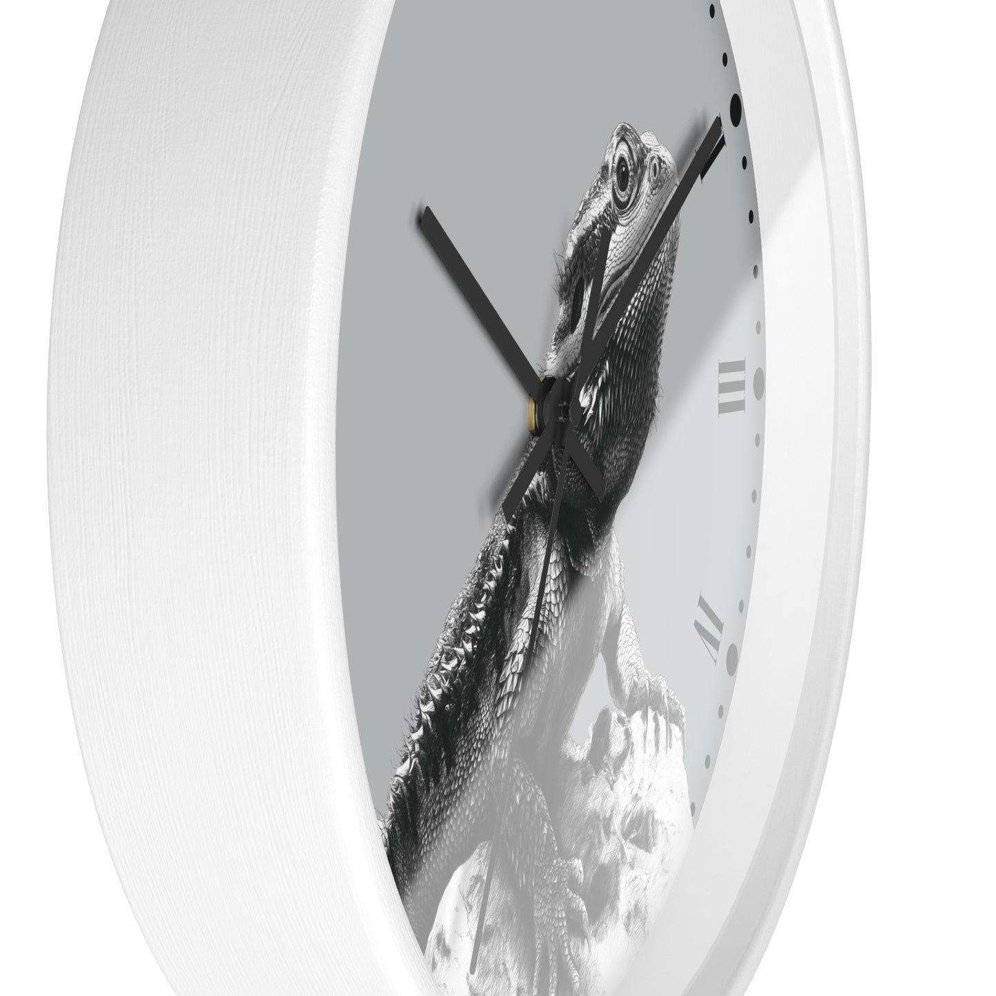 A white round wall clock with a black-and-white bearded dragon lizard graphic printed on the face, shown against a plain white background.