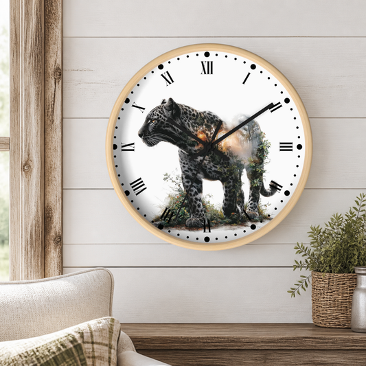A round wall clock with a light wood frame hangs on a white shiplap wall above a wooden console table. The clock face is white with black Roman numerals and a printed image of a spotted big cat standing on grass.