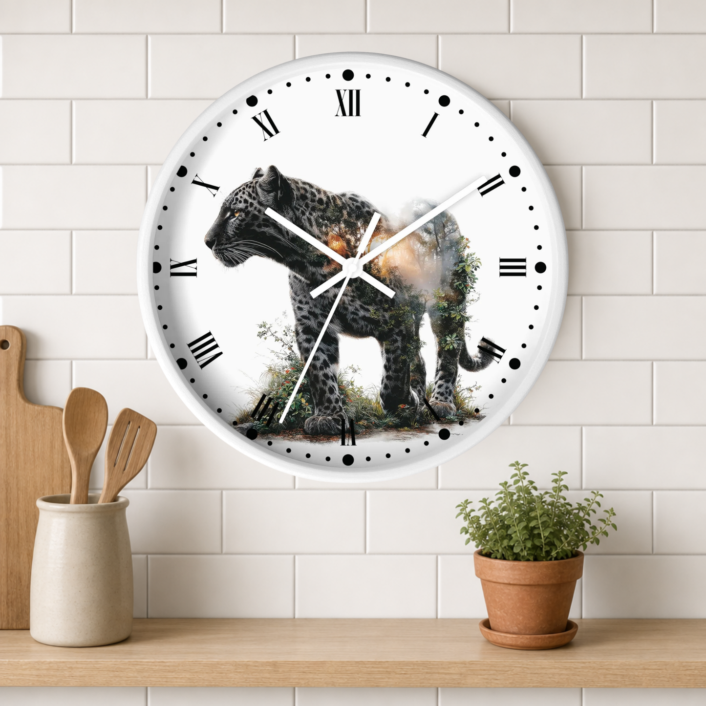 A round wall clock with a white face and Roman numerals, featuring a detailed illustration of a leopard with a smoking wound on the front. The clock is mounted on a white subway tile wall above a wooden shelf with a small potted plant and wooden utensils.