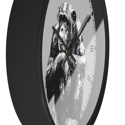 A round wall clock with a black frame and a monochrome illustration of a gorilla on the face, set against a plain white background.
