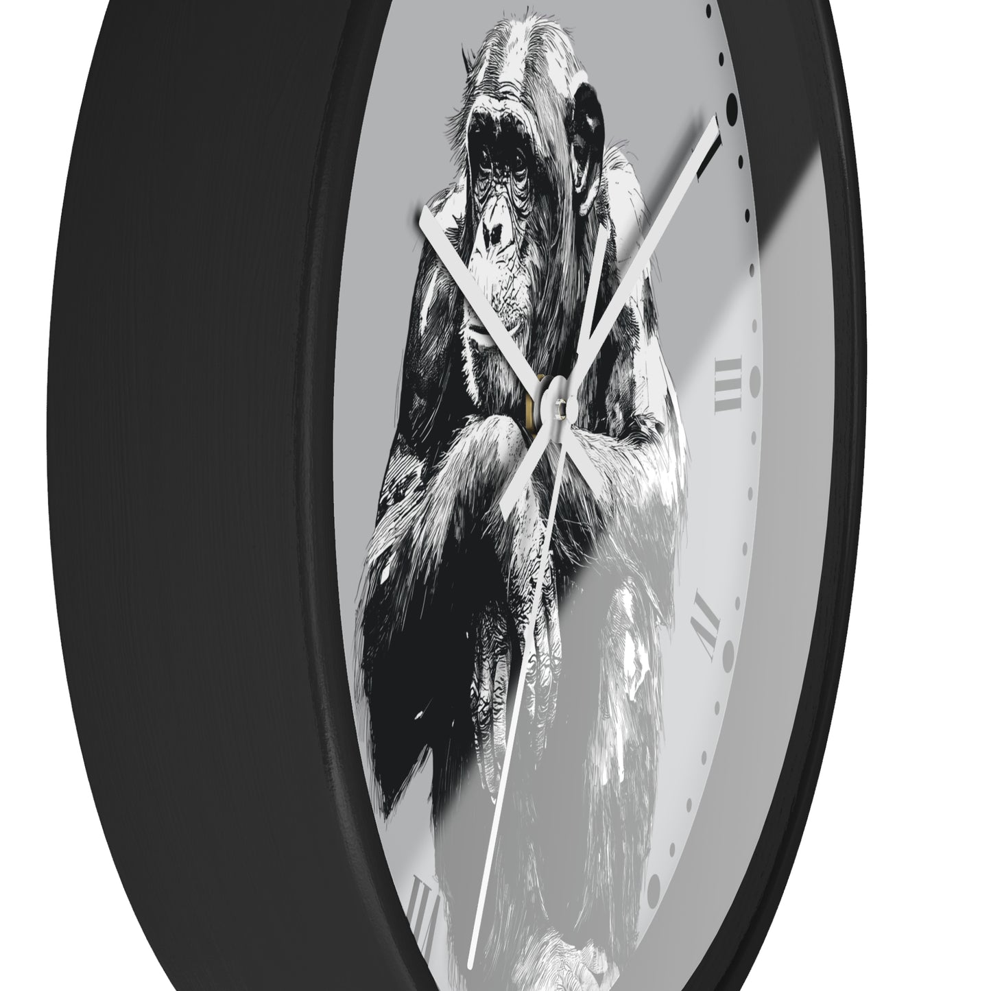 A round wall clock with a black frame and a monochrome illustration of a chimpanzee on the face, set against a plain white background.