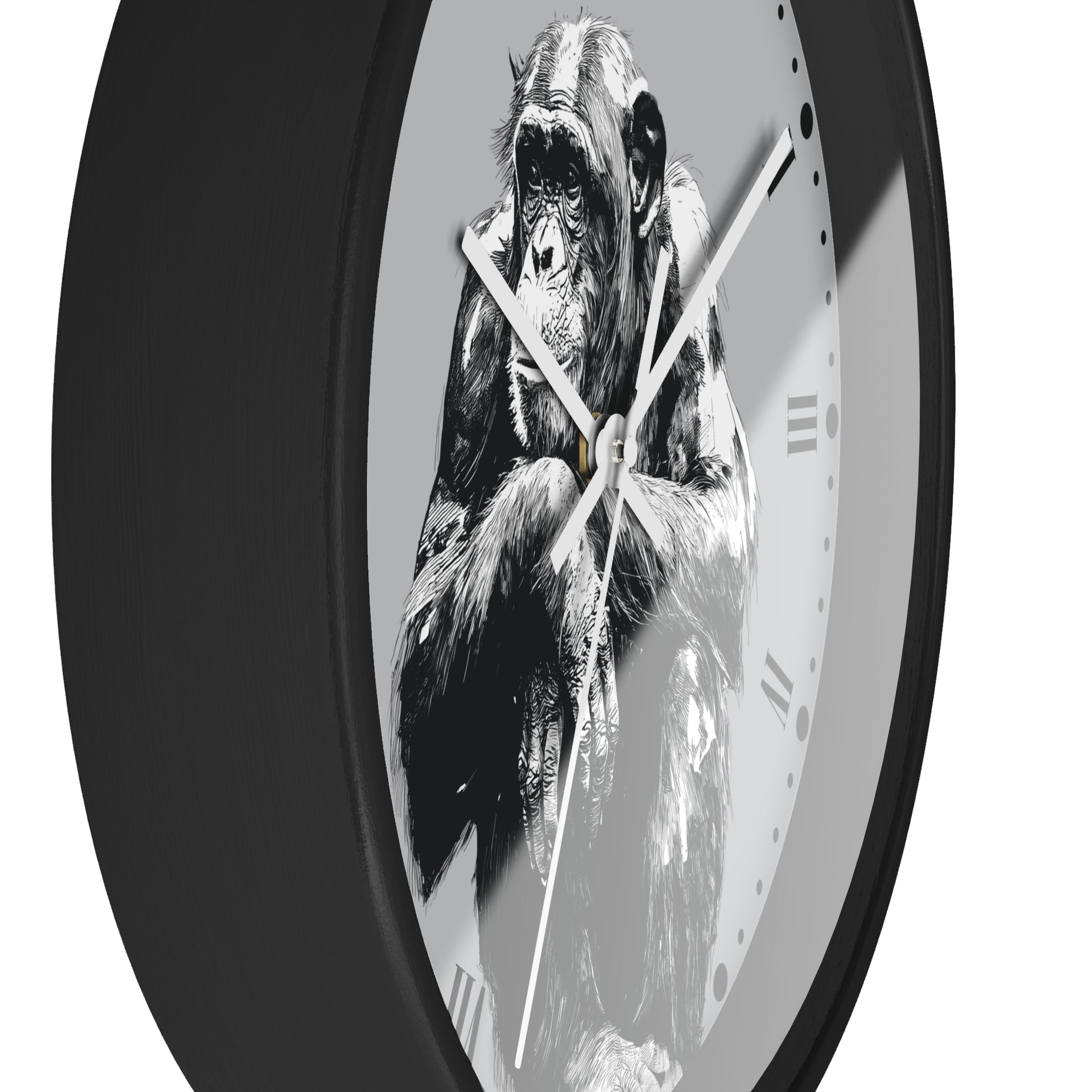 A round wall clock with a black frame and a monochrome illustration of a chimpanzee on the face, set against a plain white background.