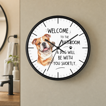 A round wall clock with a black frame and a white face, featuring a watercolor illustration of a bulldog and the text 'WELCOME TO THE BATHROOM A DOG WILL BE WITH YOU SHORTLY.