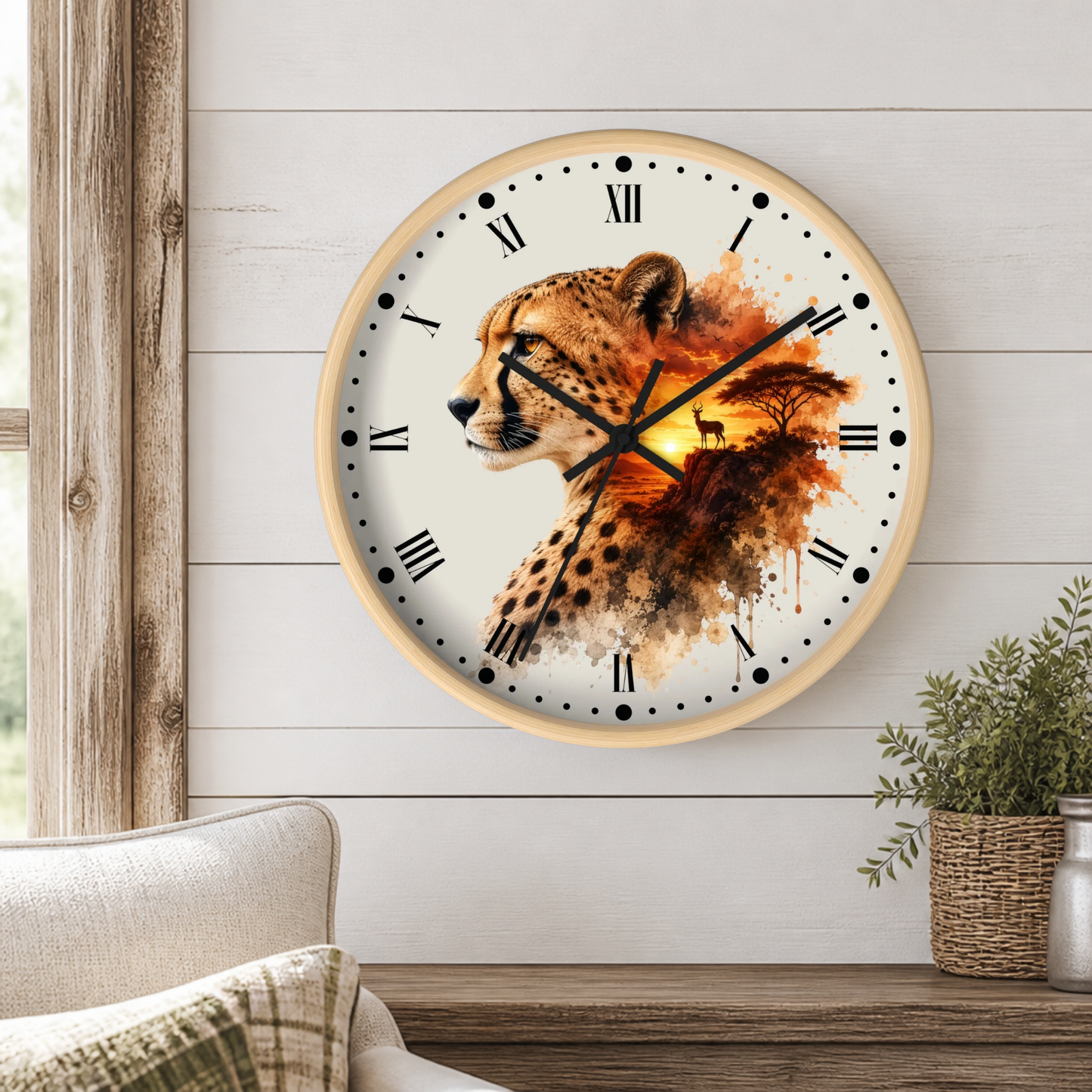 A round wall clock with a cheetah and landscape design, mounted on a white shiplap wall above a wooden table with a potted plant.