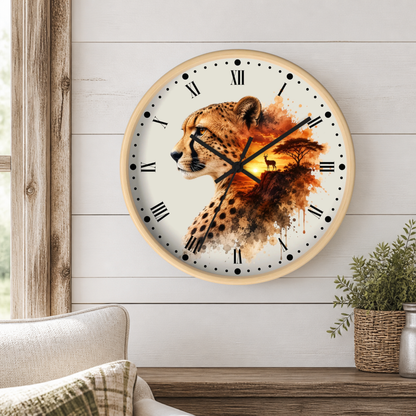 A round wall clock with a cheetah and landscape design, mounted on a white shiplap wall above a wooden table with a potted plant.