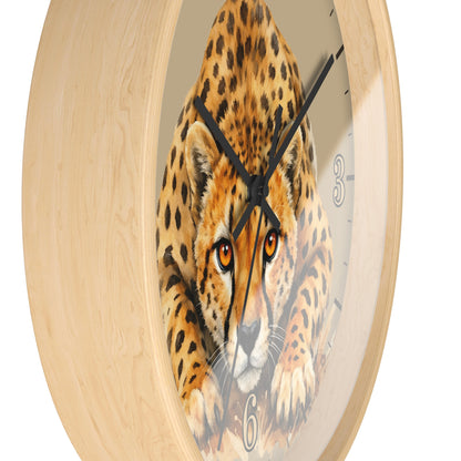 Round wall clock with a light natural wood frame and a printed cheetah face in the center, with black hands and partial black numerals visible.