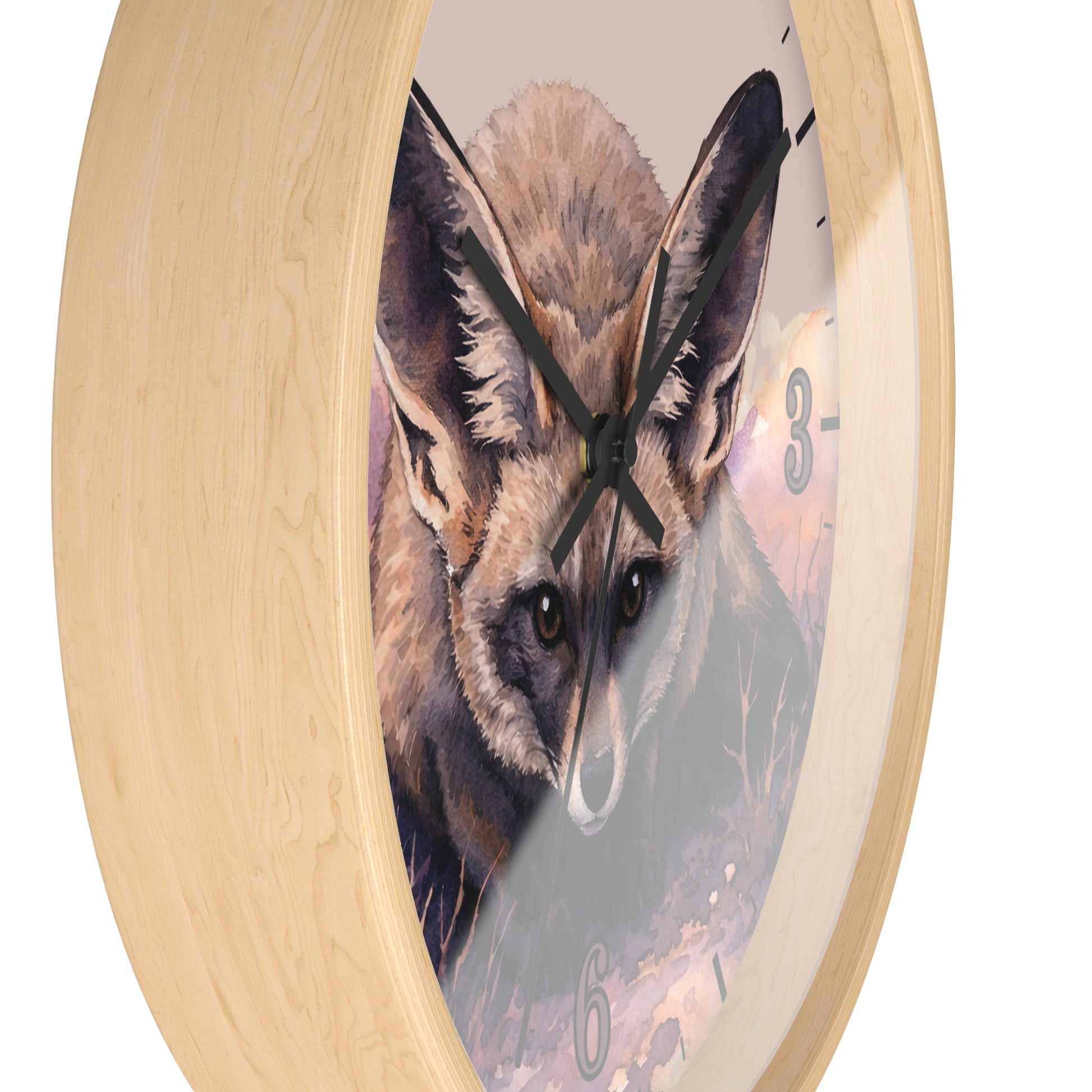 A round wall clock with a light natural wood frame and a printed fox illustration on the face, shown against a plain white background.
