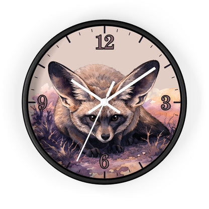Round wall clock with a black frame and a printed illustration of a fox on the face, with black Arabic numerals and white clock hands, shown on a plain white background.