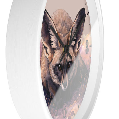A white oval wall clock featuring a detailed illustration of a fox's face on the clock face, with black hands and gray Arabic numerals.