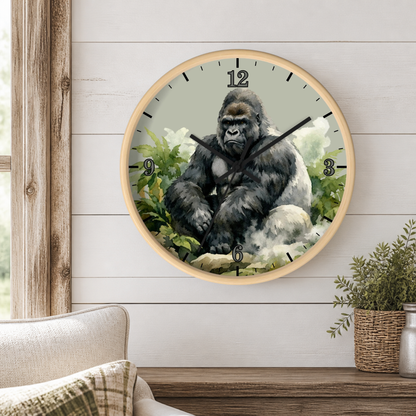A round wall clock with a light wood frame hangs on a white shiplap wall above a wooden console table. The clock face features a detailed illustration of a gorilla sitting among green foliage, with black Arabic numerals and hands.