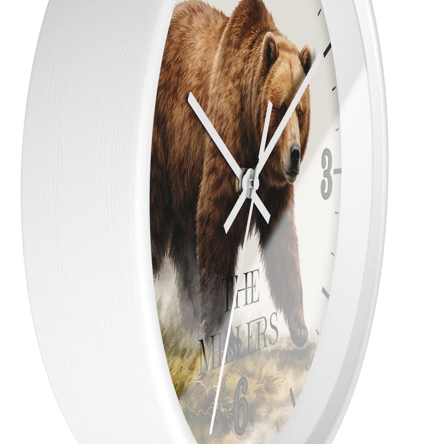 A white round wall clock with a printed brown bear illustration on the face and white hands, photographed against a plain white background.