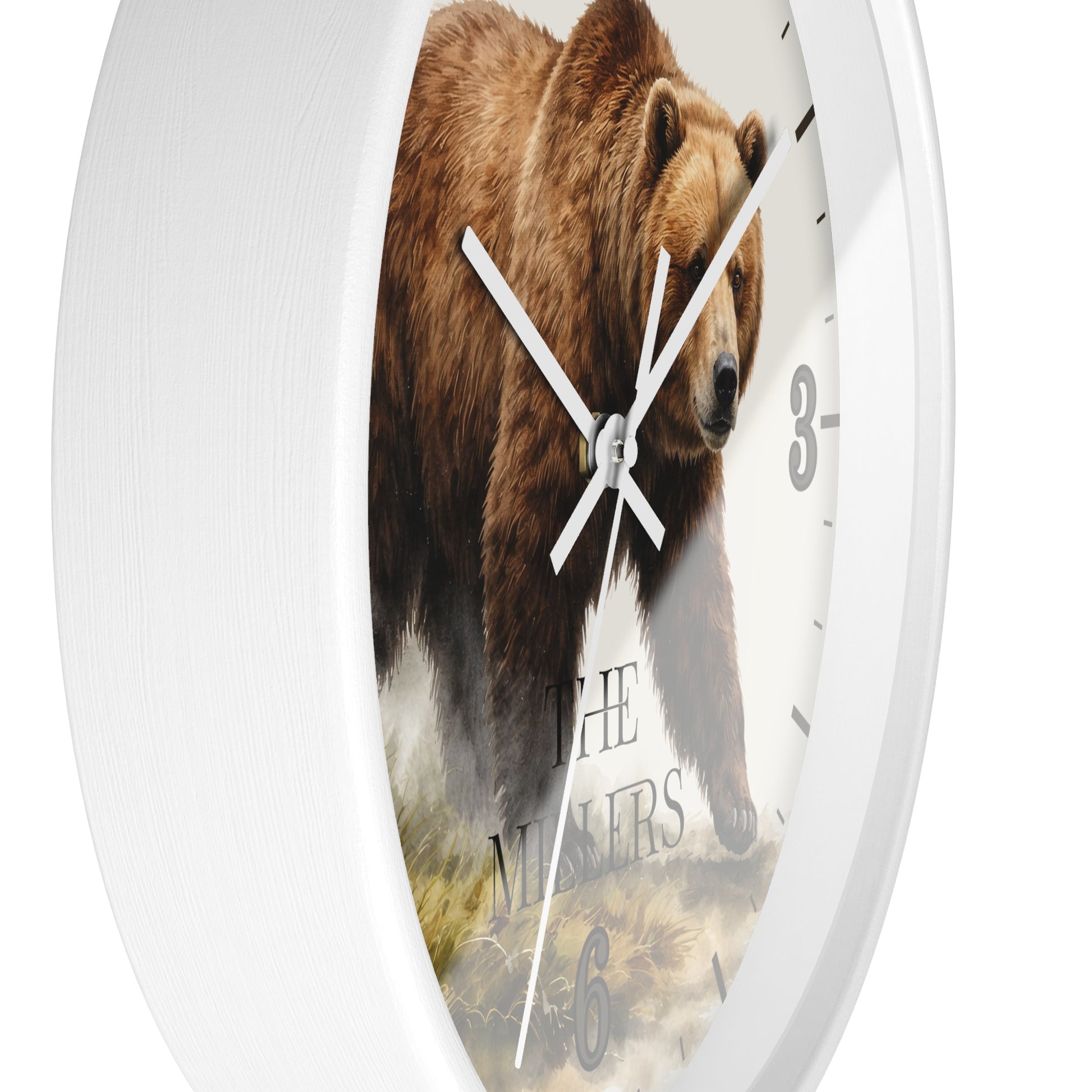 A white round wall clock with a printed brown bear illustration on the face and white hands, photographed against a plain white background.