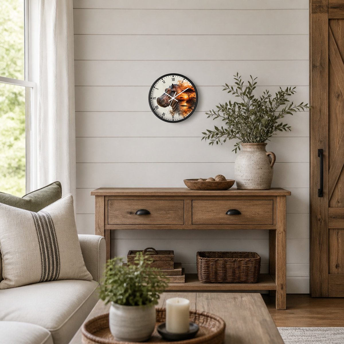 A round wall clock with a rustic wood-grain face and black Roman numerals hangs on a white shiplap wall above a wooden console table in a styled living room.