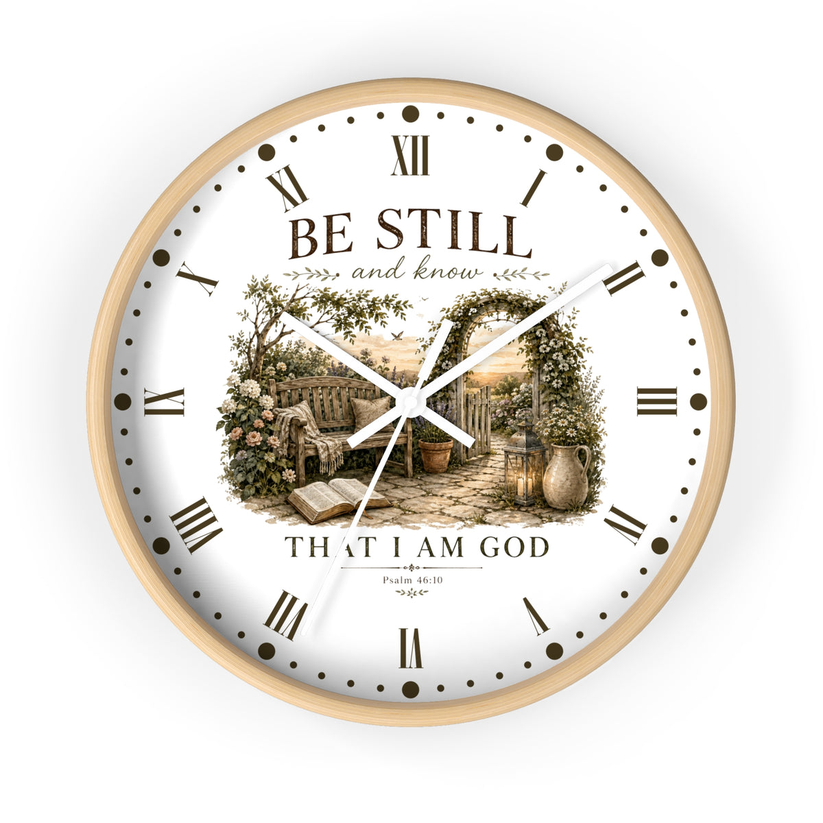 A round white wall clock with Roman numerals and a central scenic illustration of a garden bench and open book, surrounded by the words 'BE STILL and know THAT I AM GOD' and 'Psalm 46:10 NIV'.