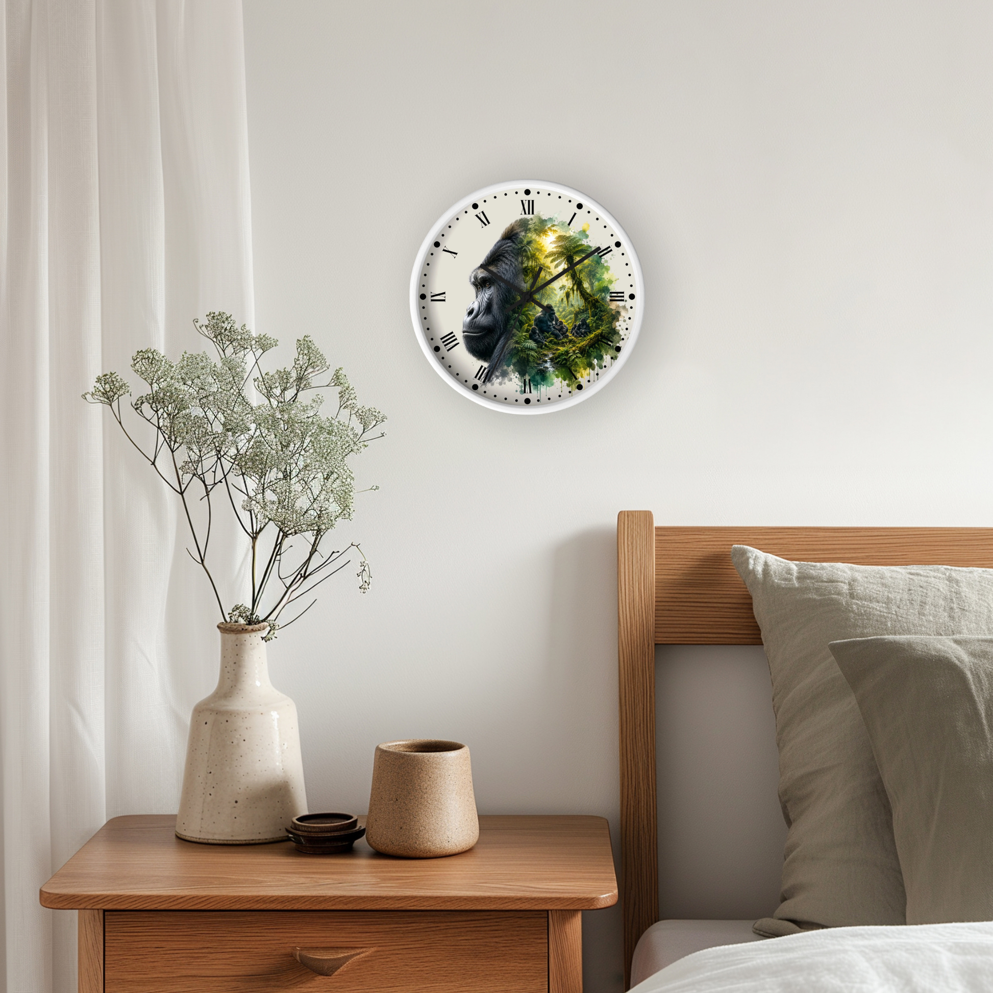 A round wall clock featuring a gorilla face with green foliage details, mounted on a light gray wall above a wooden nightstand with a vase of dried flowers.