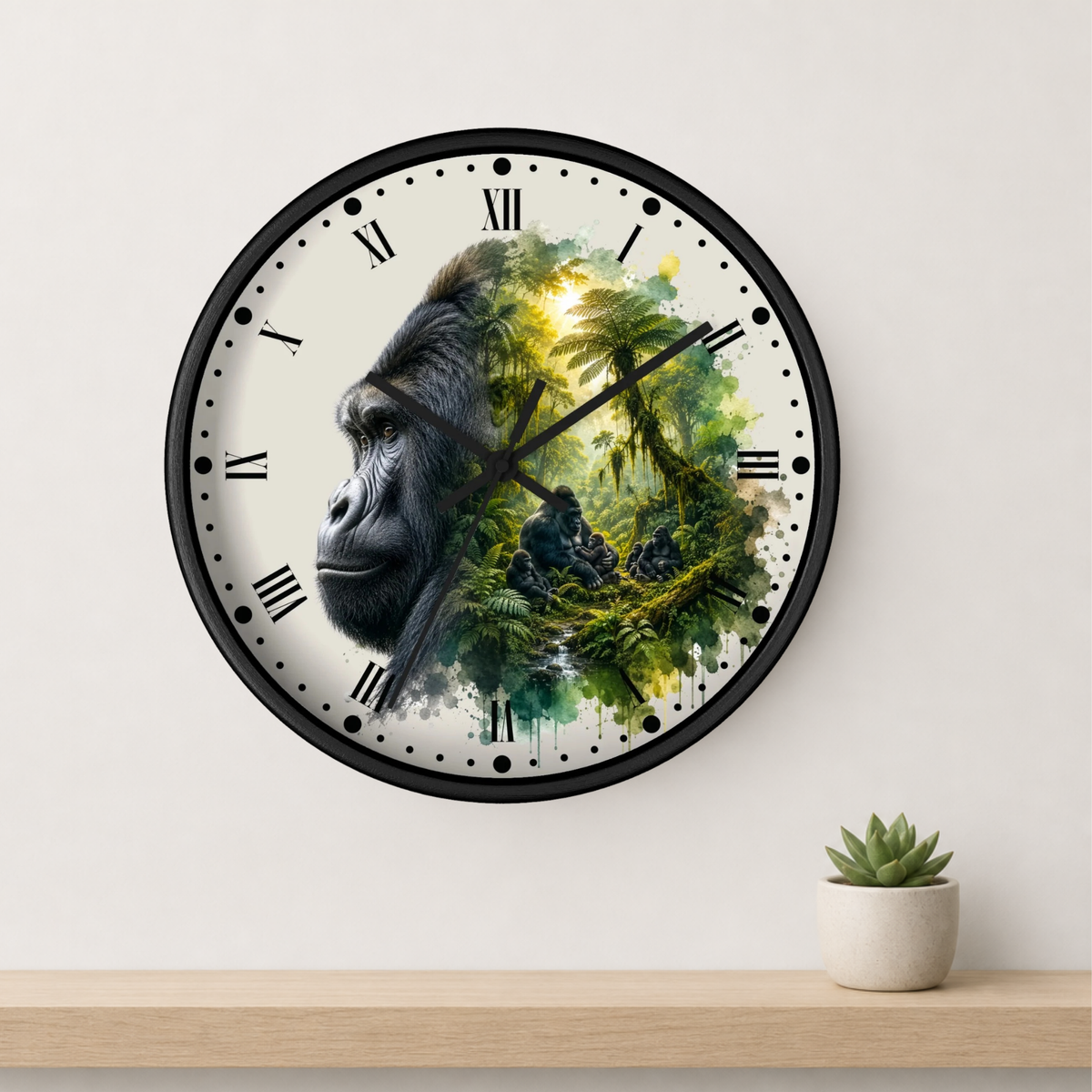 A round wall clock with a black frame and Roman numerals, featuring a split design of a gorilla's face on the left and a lush green jungle scene on the right. The clock is mounted on a light beige wall above a wooden shelf with a small potted succulent.