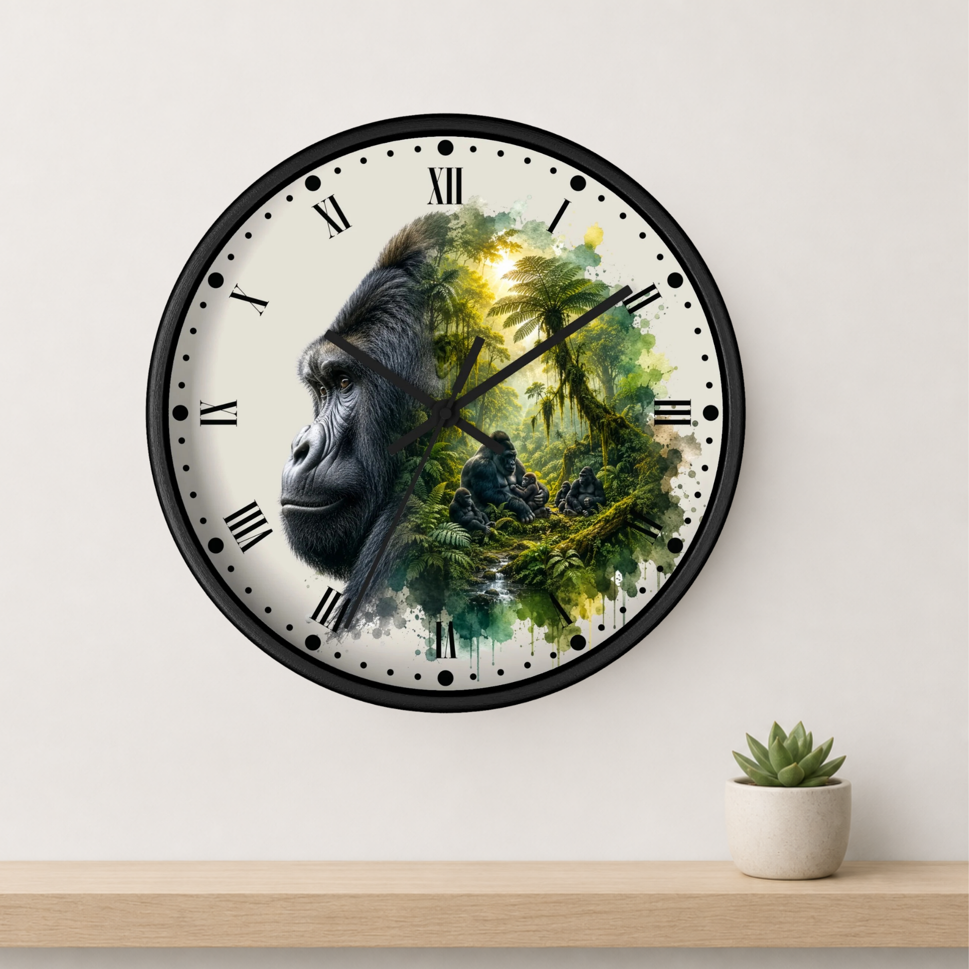 A round wall clock with a black frame and Roman numerals, featuring a split design of a gorilla's face on the left and a lush green jungle scene on the right. The clock is mounted on a light beige wall above a wooden shelf with a small potted succulent.