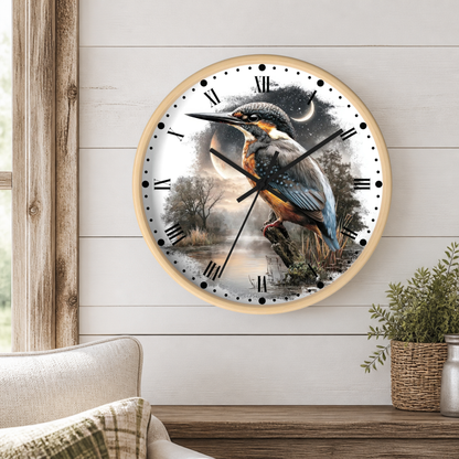 Round wall clock with a light natural wood frame and a printed bird scene on the face, showing a large kingfisher bird over a misty landscape with a moon and stars. Hanging on a shiplap wall above a table in a well lit living room.