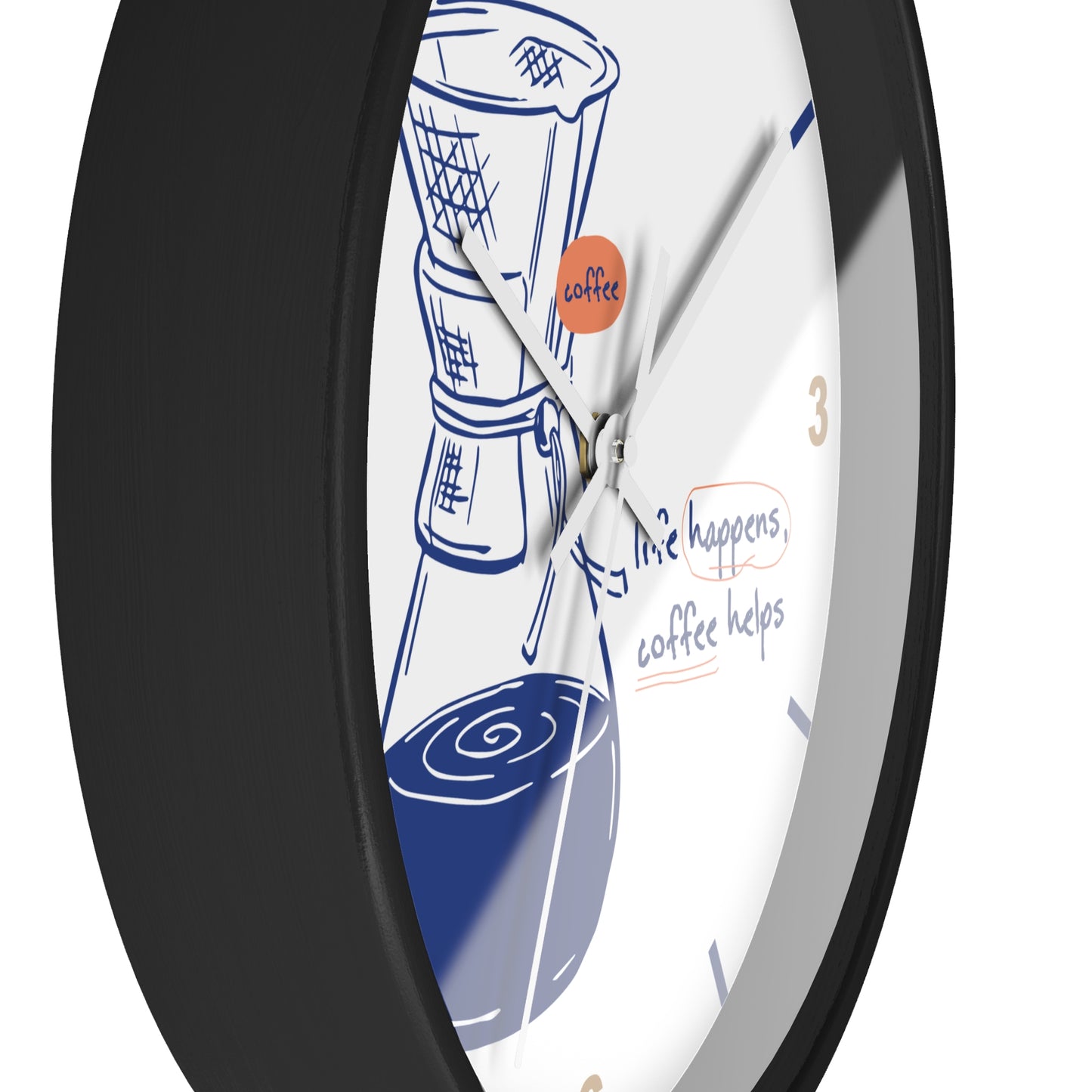 A close-up of a round wall clock with a black frame and a white face featuring a coffee maker illustration, blue coffee cup graphics, and the phrase 'life happens, coffee helps'.
