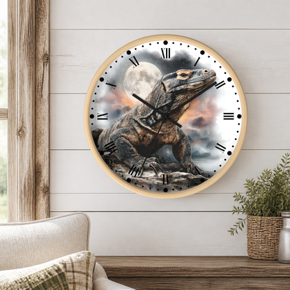 Round wall clock with a light wood frame featuring a detailed illustration of a large Komodo dragon under a full moon, mounted on a white shiplap wall above a wooden console table with a plant and part of a sofa visible.