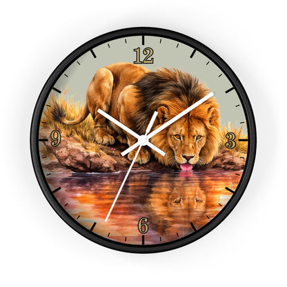 Round wall clock with a black frame and a printed lion drinking from water on the face, with gold Arabic numerals and white clock hands on a white background.