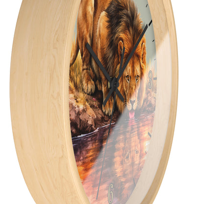Round wall clock with a light natural wood frame and a printed lion artwork on the face, shown against a plain white background.